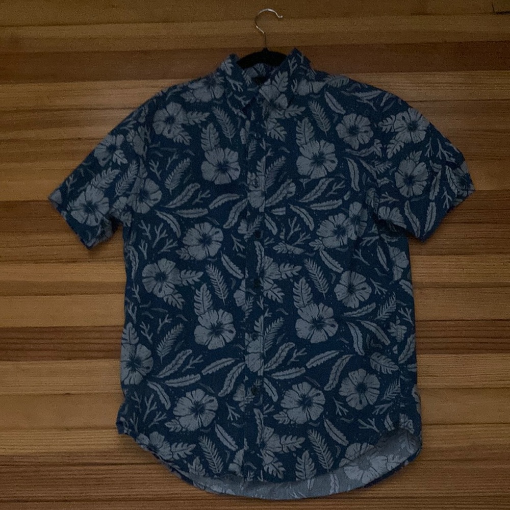 tropical button up with a beachy floral pattaren
